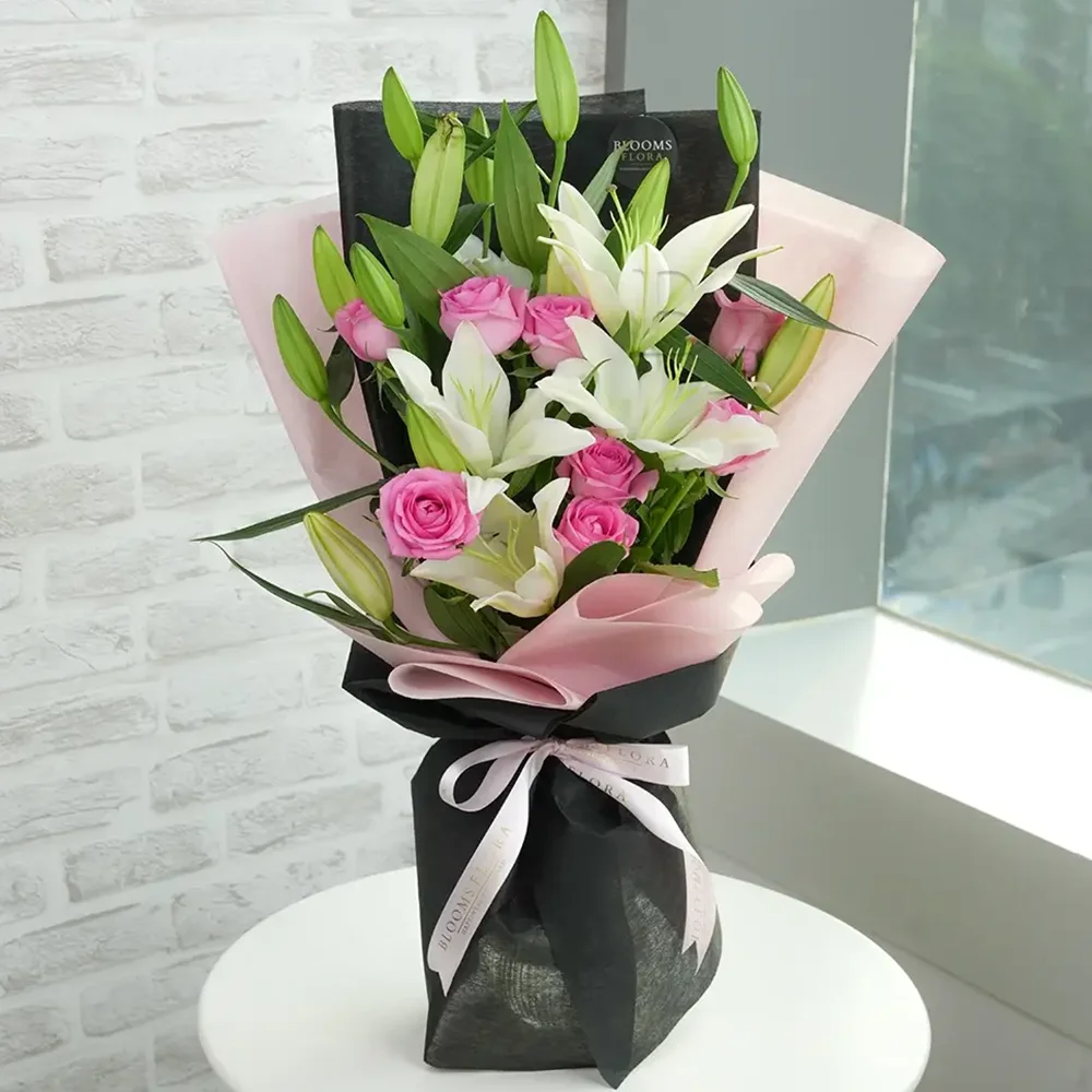 8 pink roses and 3 white lilies bouquet